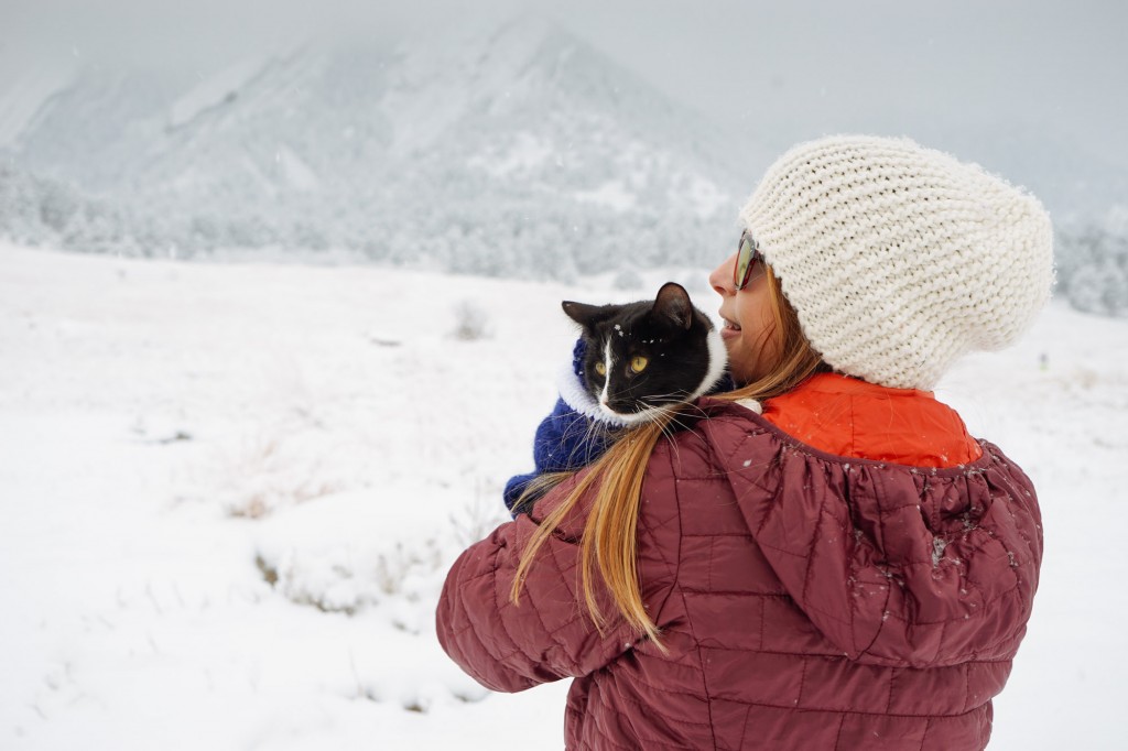 Erin Verplaetse snuggling cat on snowy day