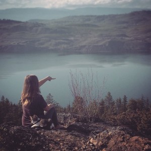woman and cat overlooking lake