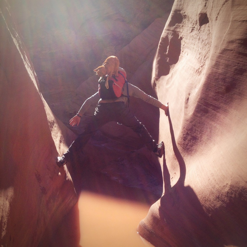 Zac Robinson with cat in slot canyon