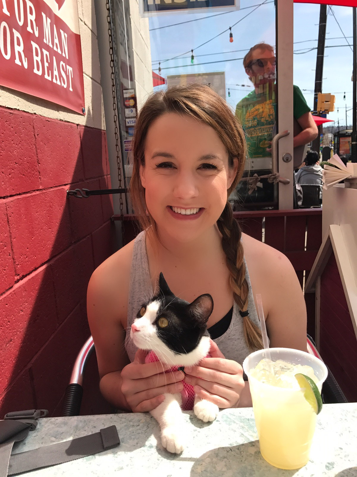 Courtney Conaway with adventure cat Lily at Pittsburgh restaurant