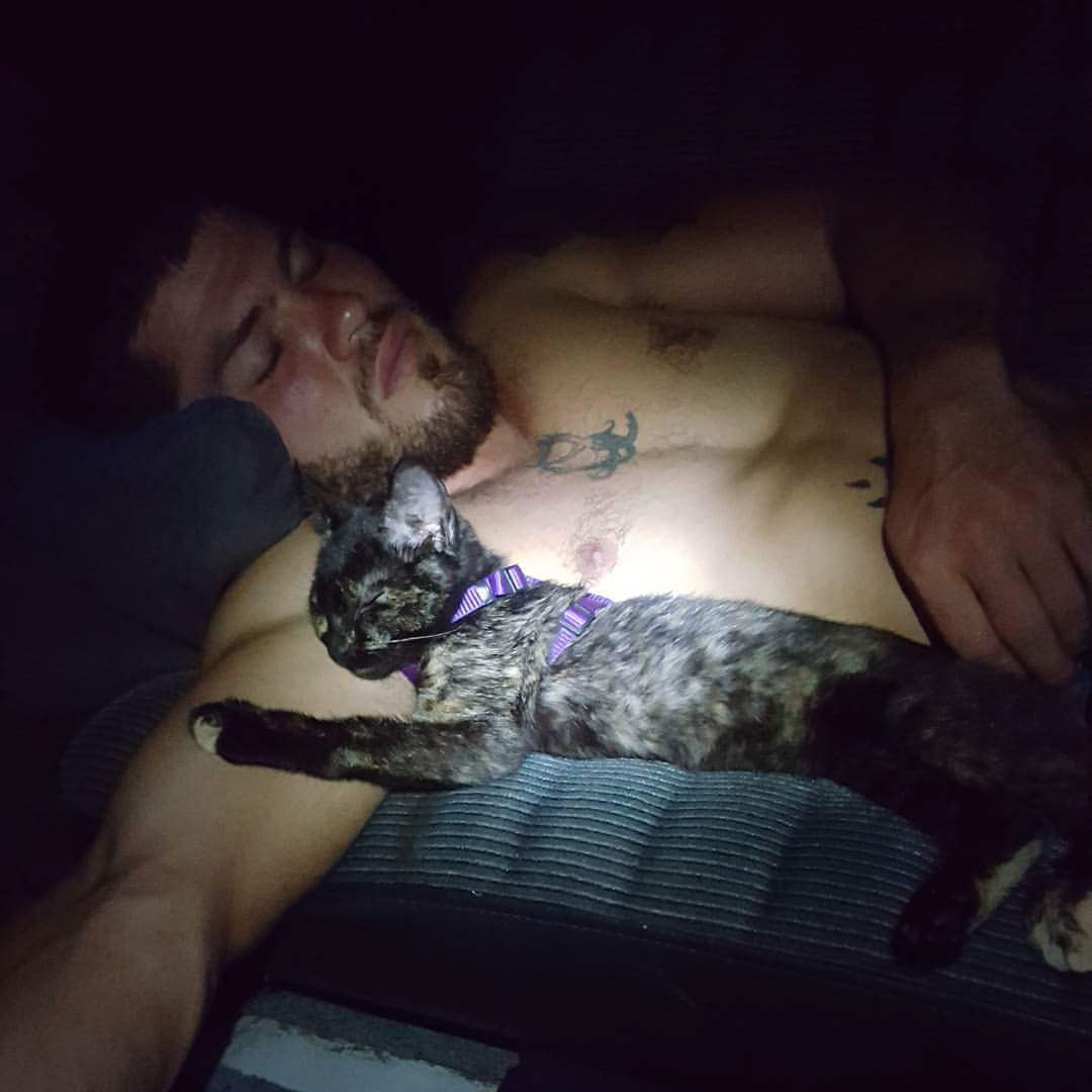 Ryan Mallon catnaps with his kitten, Ember