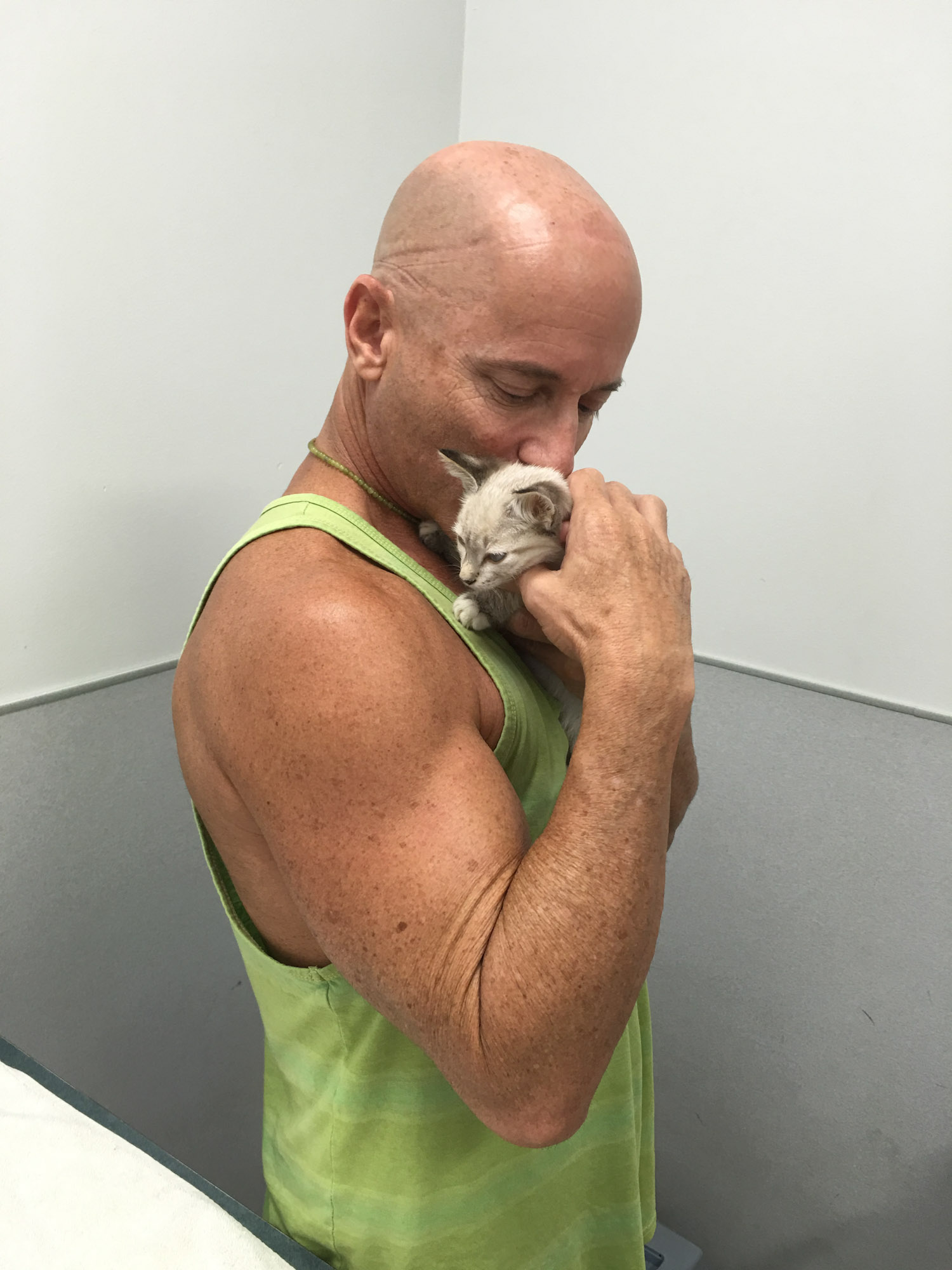 Peter Cohen snuggling kitten